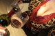 A woman in a leopard print lingerie holding a glass of wine.